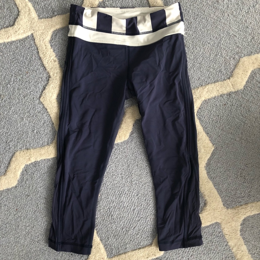 Grey lululemon crop pants with mesh detail, size 4